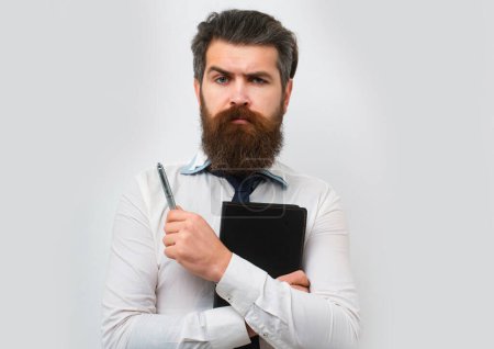 Photo for Business man is thinking about something with pencil. Business dreams. Thoughtful young man in shirt and tie holding note pad and pen - Royalty Free Image