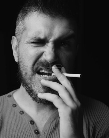 Photo for Cigarette nicotine addiction. Man smoking cigarette. Smoking addiction. Smoke on black - Royalty Free Image