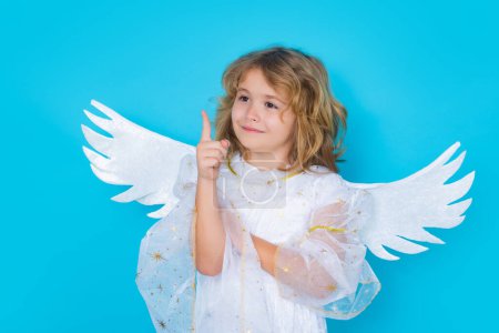 Foto de Valentines day banner. Cute child with angel wings. Studio portrait of angel child on studio color isolated background with copy space - Imagen libre de derechos