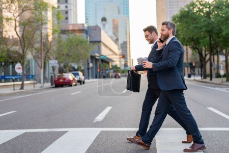 Photo for Business man in suit outdoor on american city street. Idea generation, brainstorming. Politics people. Man in suit walking across the crosswalk on american city street outdoor - Royalty Free Image