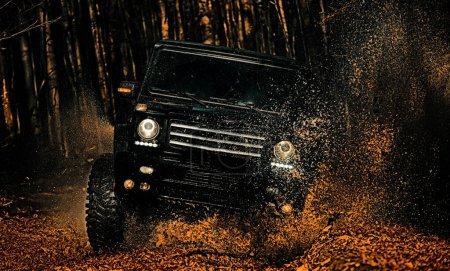 Photo for Mud and water splash in off-road racing. Off-road vehicle goes on the mountain. Jeep outdoors adventures. 4x4 travel trekking. Rally racing - Royalty Free Image