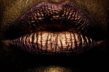 Photo for Golden lips closeup. Gold metal lip. Beautiful makeup. Golden lip gloss on beauty female mouth, closeup - Royalty Free Image
