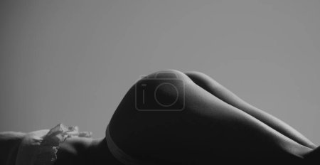 Photo for Female back and buttocks. Female butt in sexy bikini. Erotic lingerie. Bondage and bdsm concept. Seductive temptress. Slim woman dressed in lace lingerie. Lingerie sexy girl model, banner - Royalty Free Image
