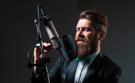 Photo for Classic singer. Man singing with music microphone - Royalty Free Image