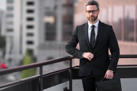 Photo for Business man outdoor portrait. Business success of businessman. Hispanic businessman at the city near office building. Businessman in suit. Portrait of businessman in suit outside on office building - Royalty Free Image