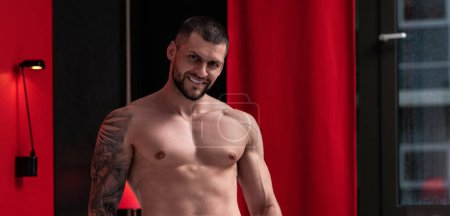 Photo for Handsome muscular man showing sexy body. Young sexy man portrait. Sexy guy with athletic flexing muscles. Sexy young handsome naked man. Seductive gay - Royalty Free Image