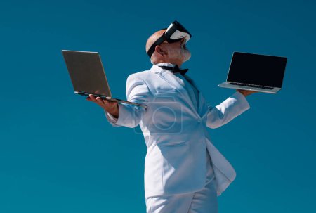 Photo for Senior old man with virtual reality and future technology concept. Old businessman in vr. Man in 3d glasses and laptop - Royalty Free Image