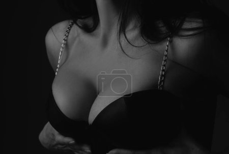 Foto de Women body. Bra model. Female breast in black bra, sexy tits in lingerie. Women body shape. Breast boobs, woman after plastic surgery. Huge breasts, big boobs - Imagen libre de derechos