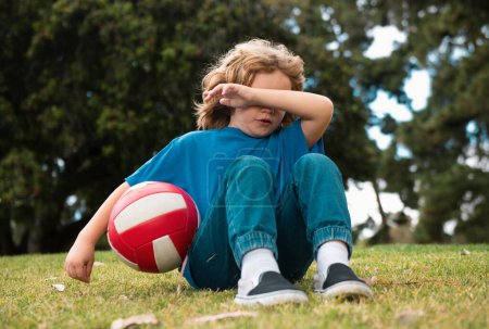 Photo for Little boy alone, lonely with ball. Loneliness kids. Children bad emotion and expression concept - Royalty Free Image