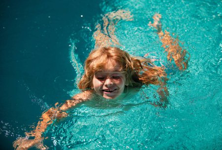 Photo for Kid boy swim in swimming pool water. Kid playing outdoors. Summer vacation and healthy lifestyle - Royalty Free Image