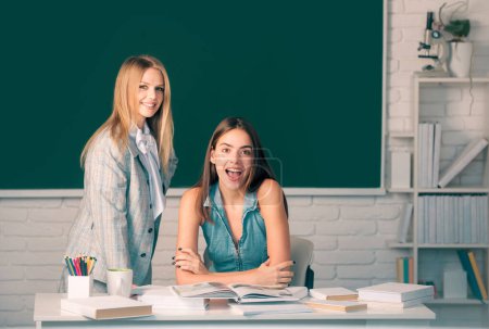 Photo for Students beautiful girls friends study together in classroom at school college or university - Royalty Free Image