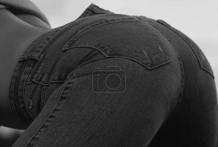 Foto de Firm buttocks in in jeans shorts. Big sexy womans butt. Beauty form ass - Imagen libre de derechos