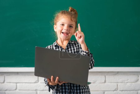 Photo for School girl studying math during online lesson in classroom, online education - Royalty Free Image