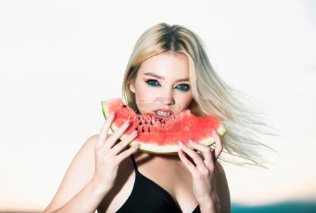 Photo for Beautiful young woman with watermelon. Positive Youth expressions girl about biting wedge of juicy watermelon enjoying summer - Royalty Free Image