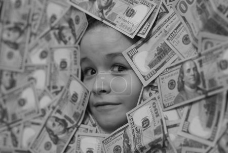 Photo for American dreams. Head in money. Fun kid face on dollars money - Royalty Free Image