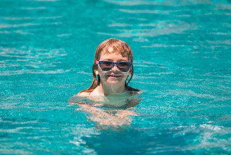 Photo for Kid in swimming pool. Kids summer vacation fun - Royalty Free Image