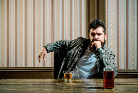 Photo for Man alcohol abuse. Drunk man in alcoholism problem, alcohol abuse and addiction concept. Bottle and glass of whisky - Royalty Free Image