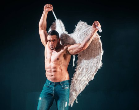 Photo for Muscle strong beautiful stripped male angel. Handsome young athletic man with a bare torso looks like an angel with white wings. Valentines day - Royalty Free Image
