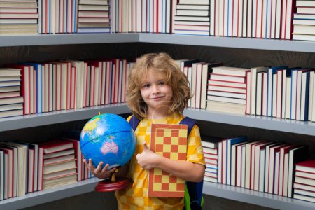 Photo for School boy with world globe and chess, childhood. School and education concept. Portrait of cute child school boy. Back to school - Royalty Free Image