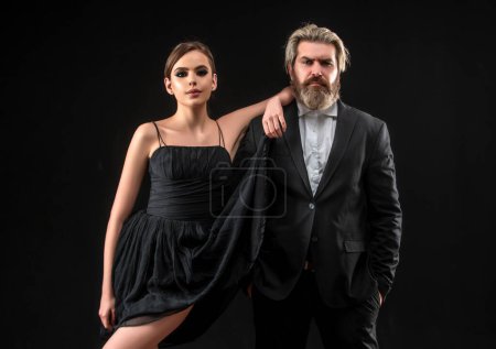 Foto de Elegant couple love. Man in a black suit. Luxurious couple. Passionate love concept - Imagen libre de derechos