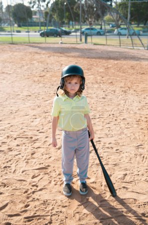 Photo for Funny kid baseball player in baseball helmet and baseball bat - Royalty Free Image