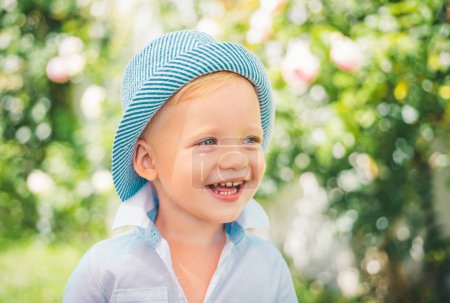 Photo for Close up portrait of cute boy smiling outdoors. Closeup headshot portrait of launching little boy on nature background, happy small preschooler child. Happy kids emotions, smiling face - Royalty Free Image