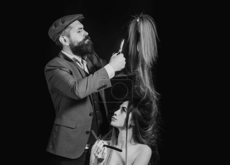 Photo for Woman with long hair at beauty studio. Barber cutting hair with scissors. Fashion hairdresser making vogue hair style, haircut - Royalty Free Image