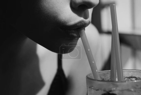 Photo for Closeup of womans lips drinking with pink straw. Woman drink cocktail. Close up wet sexy lips - Royalty Free Image