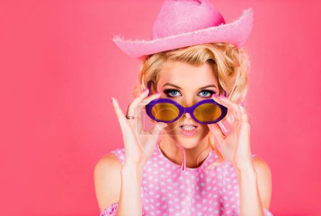 Photo for Funny blonde woman with pink cowboy hat. Young american cowgirl woman portrait. Pretty woman, fashion and beauty - Royalty Free Image