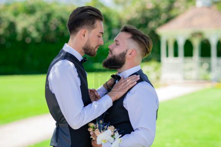 Gay man groom at wedding. Same-sex marriage and love concept. Happy gay couple on wedding. Romantic and sensual gay couple. Gay grooms together on Wedding day