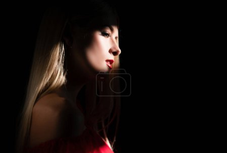 Photo for Romantic portrait of beautiful female model. Charming elegance model with sensual seductive look. Creative portraits with shadow and light over womans face, eyes on light - Royalty Free Image