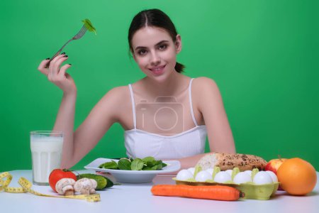 Photo for Diet plan, dieting menu or program. Woman eat vegetable. Girl weight loss and detox diet. Healthy food and dieting concept. Low carb, vegan diet. Weight loss. Low calorie diet. Detox program - Royalty Free Image