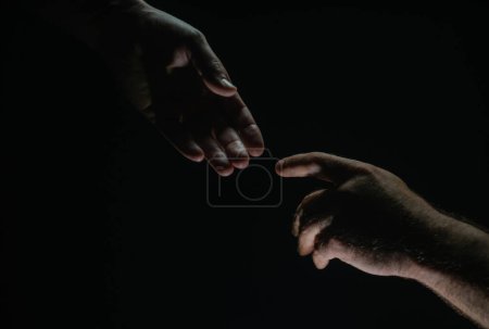 Photo for Men holding hands isolated on black. Connection and human relations. Male hands rescue. Friendly handshake, friends greeting, friendship. Rescue, helping gesture or hands. Helping hand. Hand creation - Royalty Free Image
