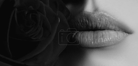 Photo for Female mouth with sexy pink lips with red rose, isolated closeup. Close up woman sensual lips with red lipstick. Passionate lip - Royalty Free Image