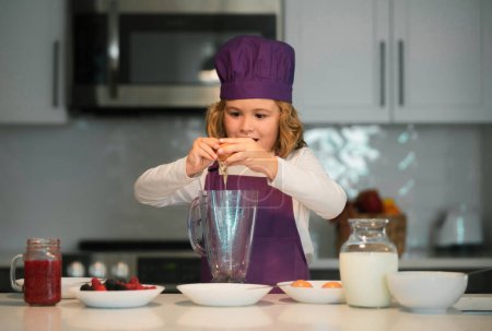 Photo for Chef child cooking. Kids are preparing the dough, bake cookies in the kitchen - Royalty Free Image