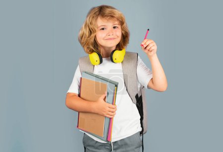 Photo for School little student hold books. Kids education concept. Child in school uniform. Portrait of happy smiling school kid. Positive emotions - Royalty Free Image