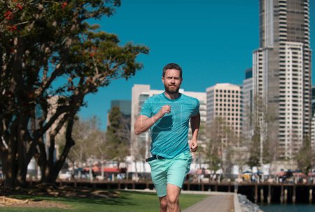 Photo for Man runner jogger running in the city on a beautiful summer day - Royalty Free Image