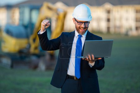 Photo for Engineer, construction manager or supervisor at a construction. Supervisor in suit and helmet. Investor, construction manager at a construction. Developer at a construction site. Middle aged architect - Royalty Free Image