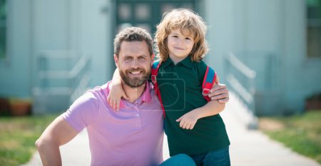 Photo for Father and son run with father after come back from school. Family, education and outdoor concept - Royalty Free Image