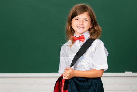 Photo for Back to school. Cute child at school. Kid is learning in class on background of blackboard. Kids education and knowledge. Student kids - Royalty Free Image