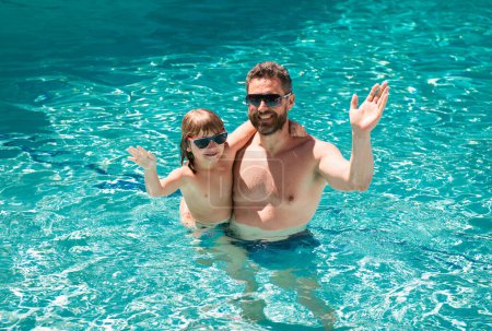 Photo for Father and son swimming in pool, summer family. Child with dad playing in swimming pool. Aquapark. Father and son leisure - Royalty Free Image