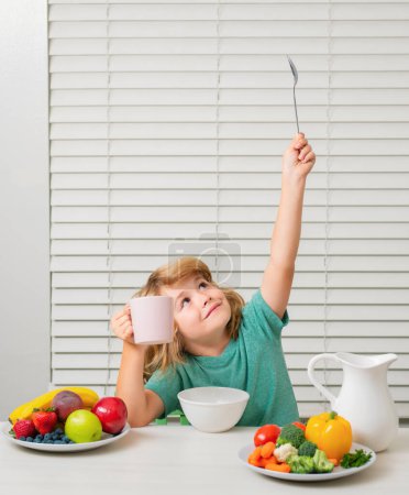 Photo for Little child boy having healthy breakfast. Kids nutrition and development. Eating vegetables by child make them healthier - Royalty Free Image