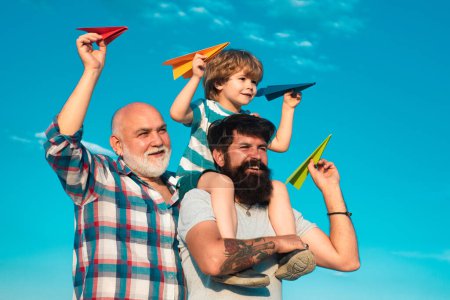 Photo for Fathers day. Family dream. Child dreams with plane. Grandfather father and child son dream. Daydreamers. Dreams and imagination. Dreamy son - Royalty Free Image