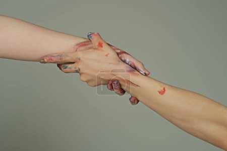 Photo for Holding hand, close up. Giving a helping hand. Rescue, helping gesture or hands. Salvation relations. Support hand. Helping hand gesture, sign of help and hope. Helping arm, charity - Royalty Free Image