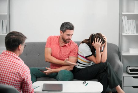 Photo for Social worker psychologist talking to young couple. Couple telling the psychologist about marital family problems. Marriage counseling, marital problems - Royalty Free Image