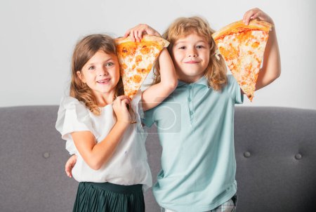 Photo for Pizza and kids, slices pizza in kids hand. Children eating tasty fast food pizza with cheese. Happy kids holding pizza slice near face. Funny children having fun together - Royalty Free Image