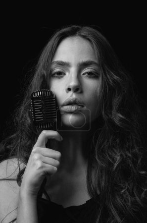 Photo for Woman with retro microphone. Closeup girl singer. Concert, sing - Royalty Free Image