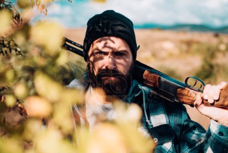 Photo for Hunter with shotgun gun on hunt. Man holding shotgun - Royalty Free Image