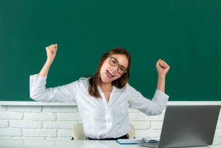 Photo for Portrait of funny excited young woman student in university or high school college - Royalty Free Image