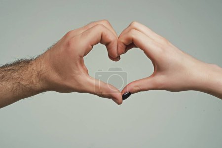 Photo for Female and male hands in form of heart. Hands in shape of love heart. Hearts froms hands. Love concept. Sign heart by fingers. Love on Valentine day. Two human hold hand gesturing love shape symbol - Royalty Free Image